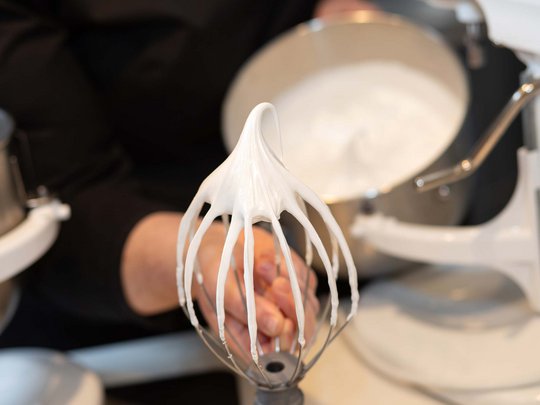 Seminar rooms at Hotel Böhlerstern: our Genusslabor® Whipped cream on mixer whisk attachment in kitchen setting