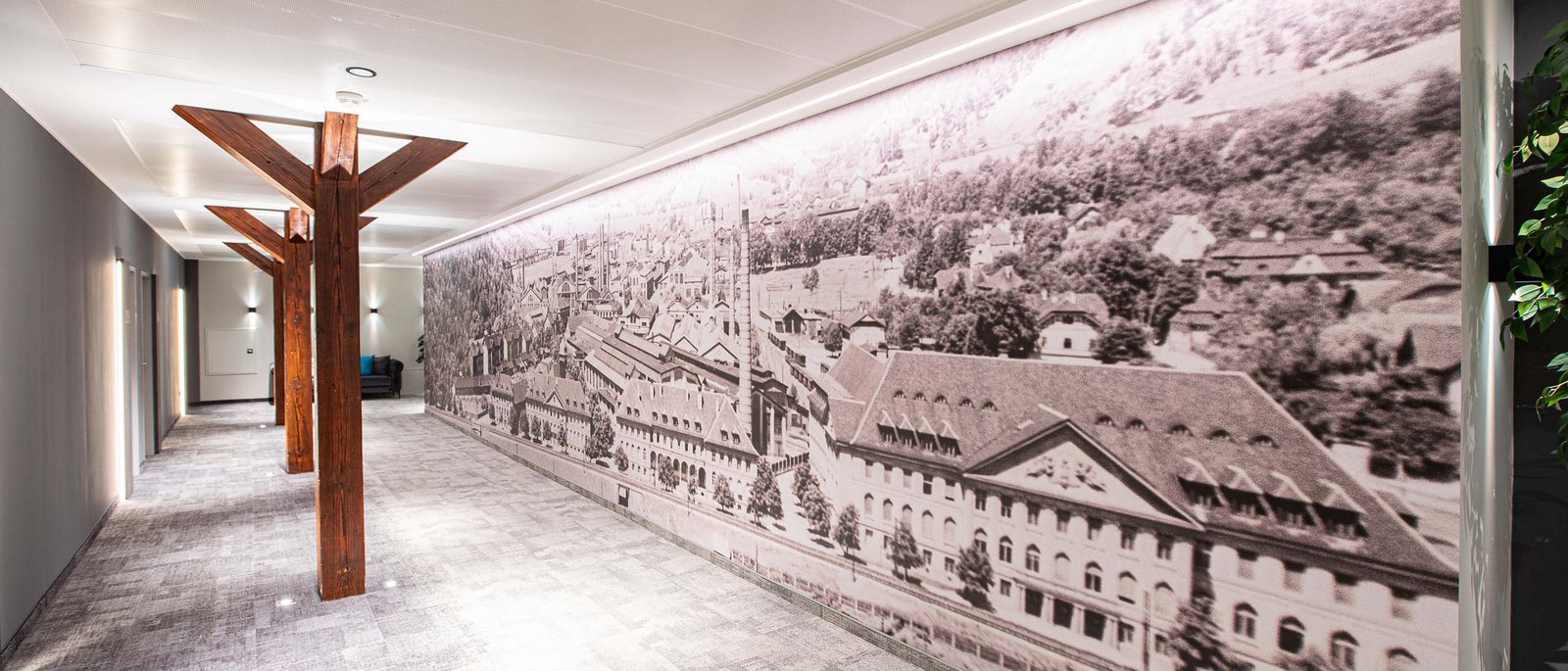 Double room Hallway with mural of old town and wooden beams in modern building