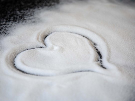 Seminar rooms at Hotel Böhlerstern: our Genusslabor® Heart shape drawn in white granulated sugar on a dark surface