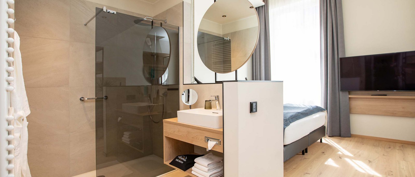 Double room Modern hotel room with open bathroom and shower